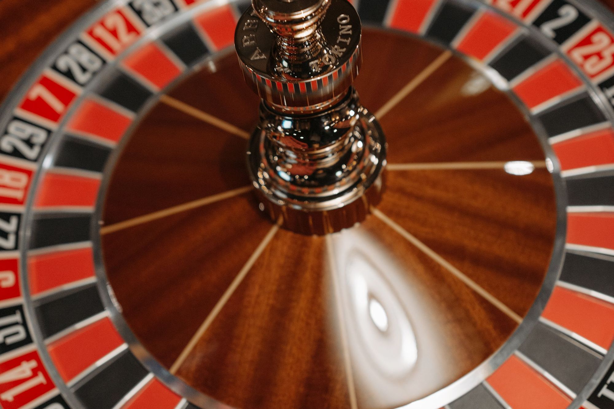 Close-up of a spinning roulette wheel with red and black numbered pockets